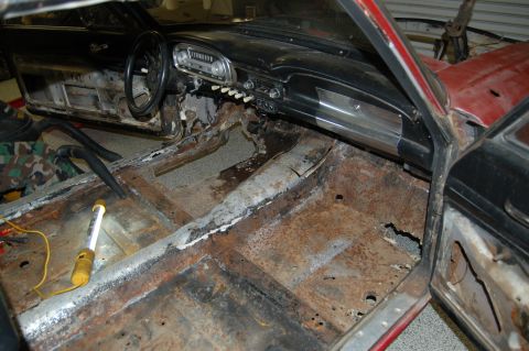 1963 Ford Ranchero - The interior of this vehicle shows extensive rust damage on the floor pans and structural components.