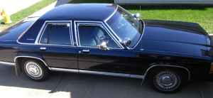 1991 Ford Crown Victoria LTD - This 1991 Ford Crown Victoria LTD is captured in a 3/4 front view, its dark blue exterior.