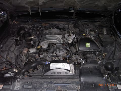 1991 Ford LTD Crown Victoria - Engine bay of a 1991 Ford Crown Victoria LTD, showing the V8 engine and associated components.