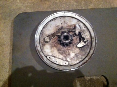 1981 Garelli Rally Sport - Moped brake drum assembly with internal mechanism visible, resting on a surface.