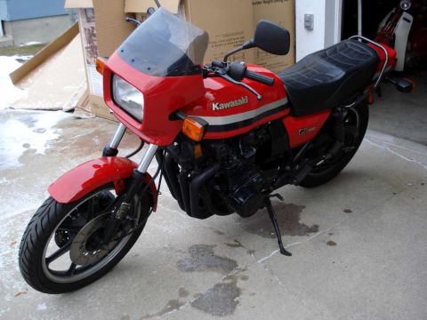 2008 Ford Crown Victoria - This red Kawasaki GPz1100 motorcycle is parked in a garage with boxes in the background.
