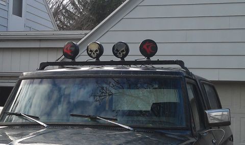 1979 Ford Bronco - Roof rack lights with skull graphics are visible on the vehicle's roof.