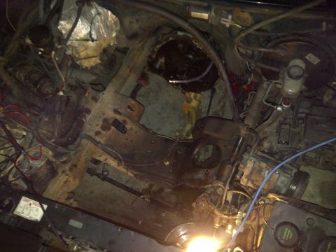 1995 Ford Bronco - Engine bay during a swap or repair, with many parts disconnected or removed.