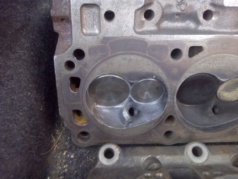 1995 Ford Bronco - Engine cylinder head showing intake and exhaust ports.