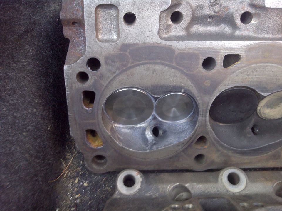 Close-up of an engine cylinder head with two valves visible