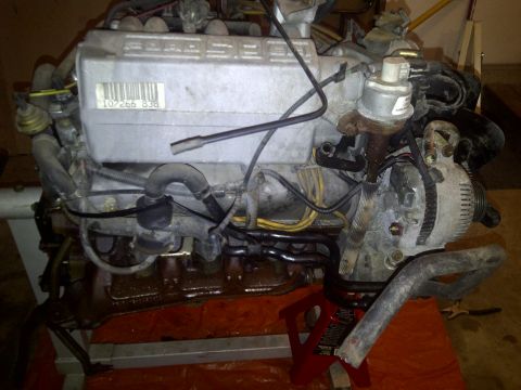 1995 Ford Bronco - Engine assembly with visible part numbers and electrical components.