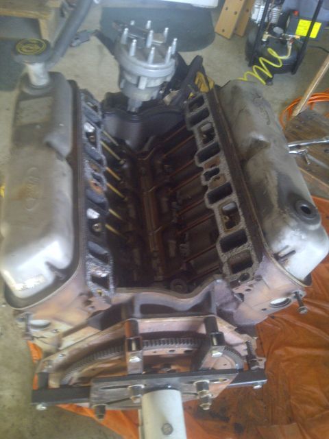 1995 Ford Bronco - Engine block assembly with distributor and valve covers visible, likely a Ford V8.