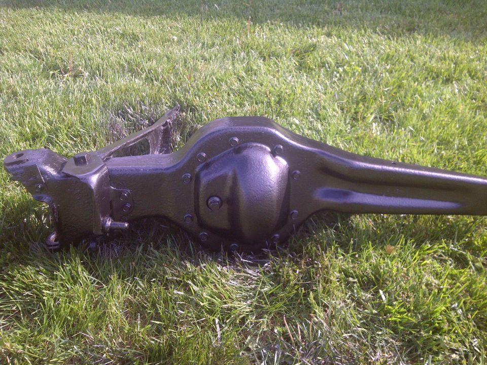 Black rear axle assembly on grass
