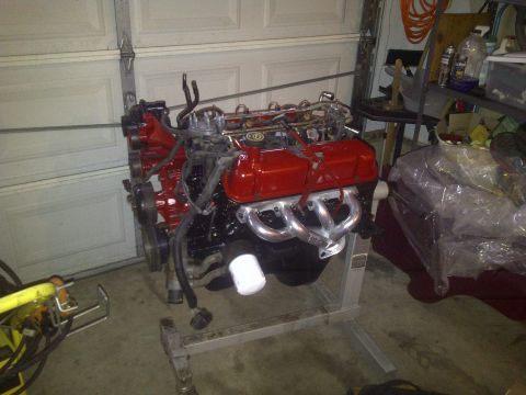 1995 Ford Bronco - Engine on stand in garage, possibly for a Ford Bronco swap.