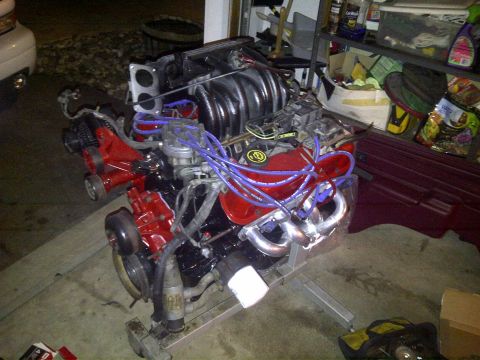1995 Ford Bronco - A Ford 351W engine is mounted on a stand, showing its various components and wiring.