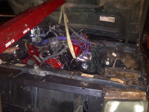 1995 Ford Bronco - Engine being installed into the 1995 Ford Bronco's engine bay.