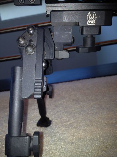 2013 Ford Mustang - Close-up view of a GGG gun bipod, showing its adjustable components and branding.