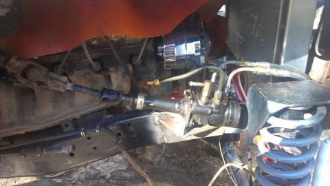 1978 Ford Bronco - Steering linkage and alternator detail.