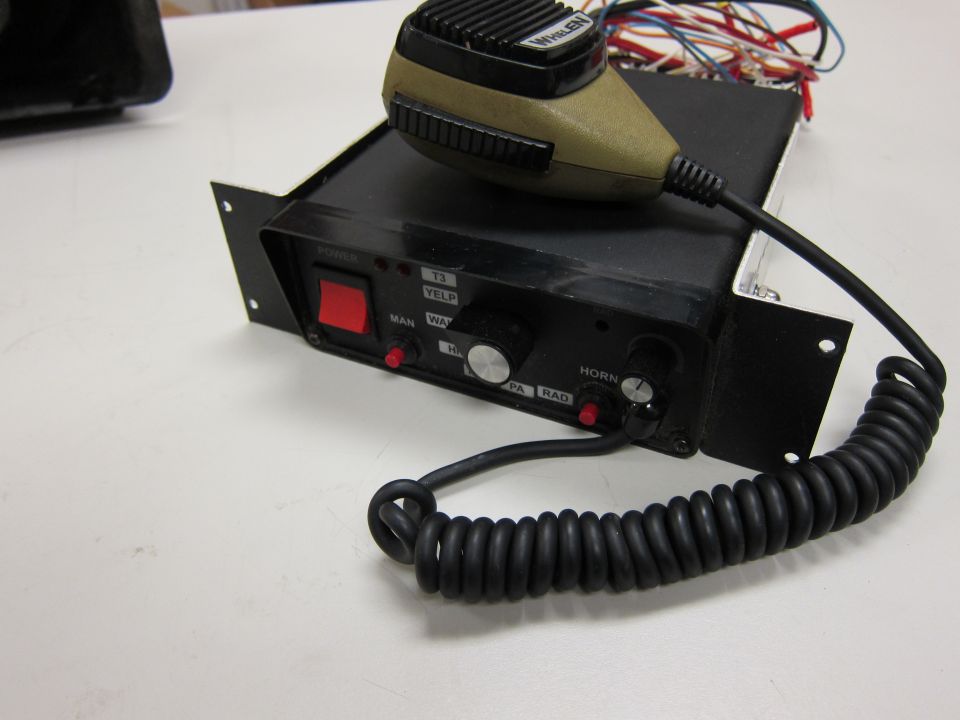 Police siren control box with microphone, labeled 'POWER', 'MAN', 'WAY', 'T3', 'YELP', 'HI', 'PA', 'RAD', 'HORN'