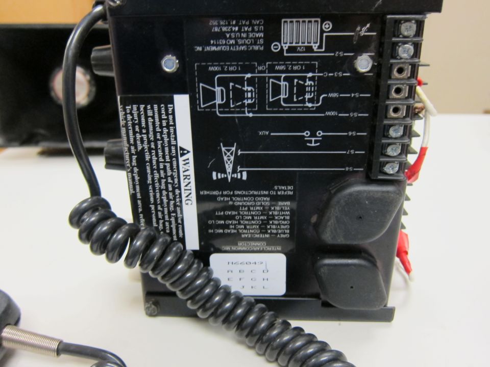 Black siren control unit with wiring diagram and warning label