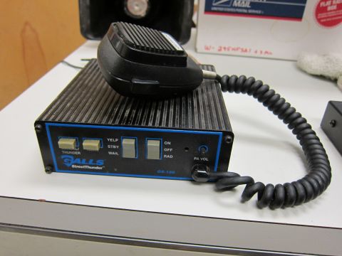 2001 Ford Crown Victoria - A Galls StreetThunder GS-150 siren control unit is shown with its microphone and coiled cord attached.