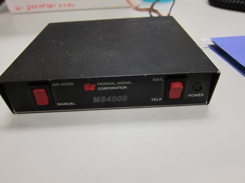 2001 Ford Crown Victoria - Federal Signal Corporation MS4000 siren control box, likely for emergency vehicles.