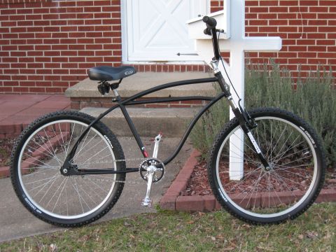 1994 Ford Bronco - This custom cruiser bicycle features a unique frame design and wide tires, set against a residential backdrop.