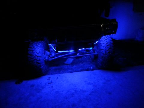 1978 Ford Bronco - Off-road vehicle with blue underglow lighting installed on the chassis.