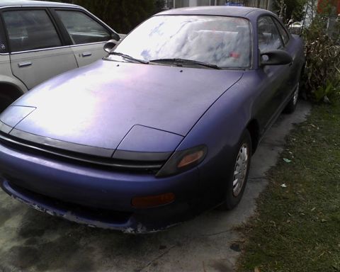 1991 Toyota Celica - This 1991 Toyota Celica is seen parked outdoors next to another vehicle.