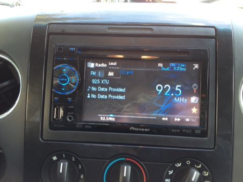 2008 Ford F-150 - Pioneer car stereo unit with radio station and input options displayed.