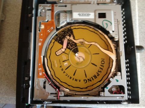 2008 Ford F-150 - Internal components of an electronic device with a CD visible.