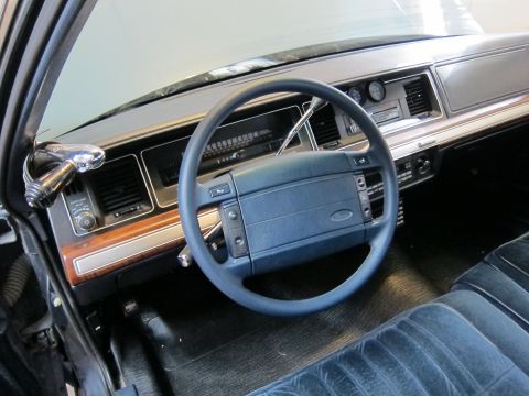 1991 Ford LTD Crown Victoria - Interior view of a 1991 Ford Crown Victoria LTD, highlighting the dashboard and seating.