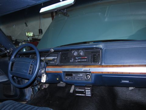 1991 Ford LTD Crown Victoria - Dashboard view of a 1991 Ford Crown Victoria LTD, a police scanner mounted below the radio.