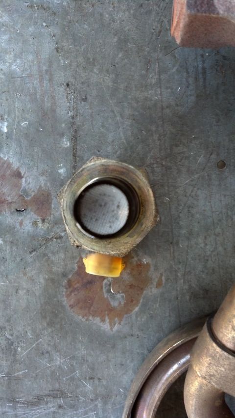 1995 Ford Bronco - Metal fitting with a yellow cap, likely a component from a larger assembly.