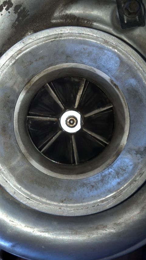 1995 Ford Bronco - The image shows the internal components of a turbocharger, specifically the turbine wheel.