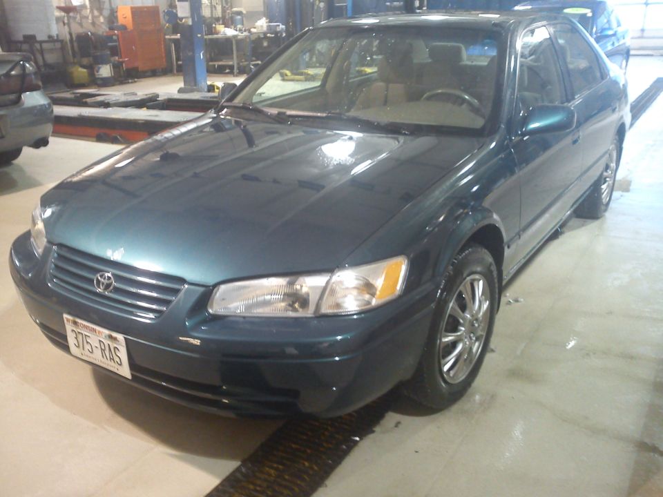 Dark teal 1998 Toyota Camry sedan, front quarter view. License plate 375-RAS