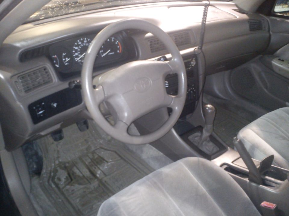 1998 Toyota Camry interior showing dashboard, steering wheel, and seats