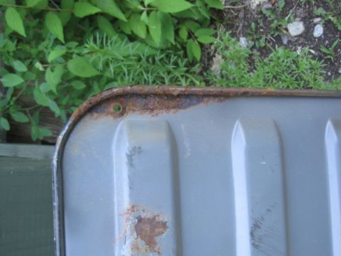 1993 Ford Bronco - A close-up view of a rusted metal part, possibly from a vehicle, with visible corrosion.