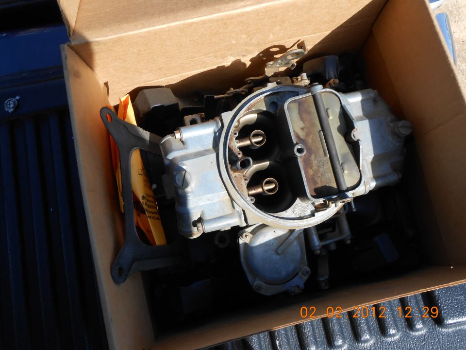 Carburetor in a cardboard box, close-up view