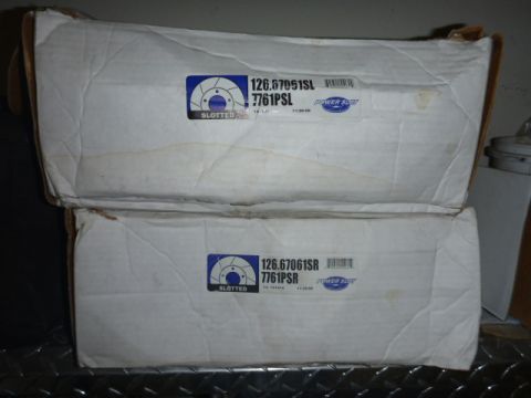 1997 Ford Ranger - Two boxes of slotted brake rotors are stacked, with labels indicating part numbers and manufacturer information.