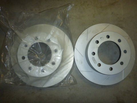 1997 Ford Ranger - Pair of brake rotors shown, one still in its original packaging.