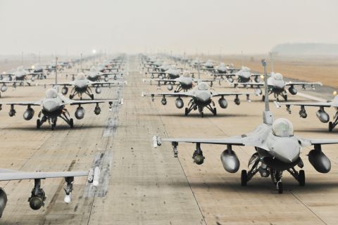 1989 Ford Bronco - A formation of F-16 fighter jets sits ready on the tarmac.