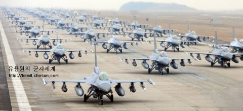 1989 Ford Bronco - A formation of fighter jets lines up on a runway, ready for deployment.