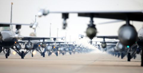 1989 Ford Bronco - A formation of fighter jets lines up on a runway, ready for deployment.