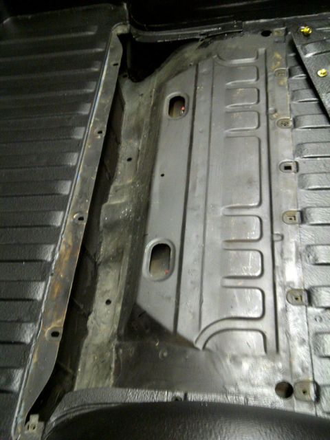 1971 Ford Ranchero - Interior view of a truck bed, showing the metal floor and side panel details.