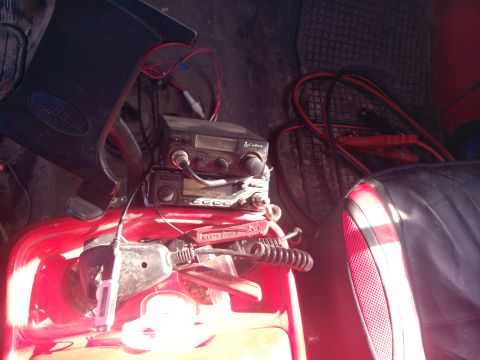 1979 Ford Bronco - Interior shot showing a Cobra CB radio and jumper cables, likely in an older vehicle.