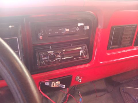 1979 Ford Bronco - Interior view of a 1979 Ford Bronco dashboard, climate controls and an aftermarket stereo.