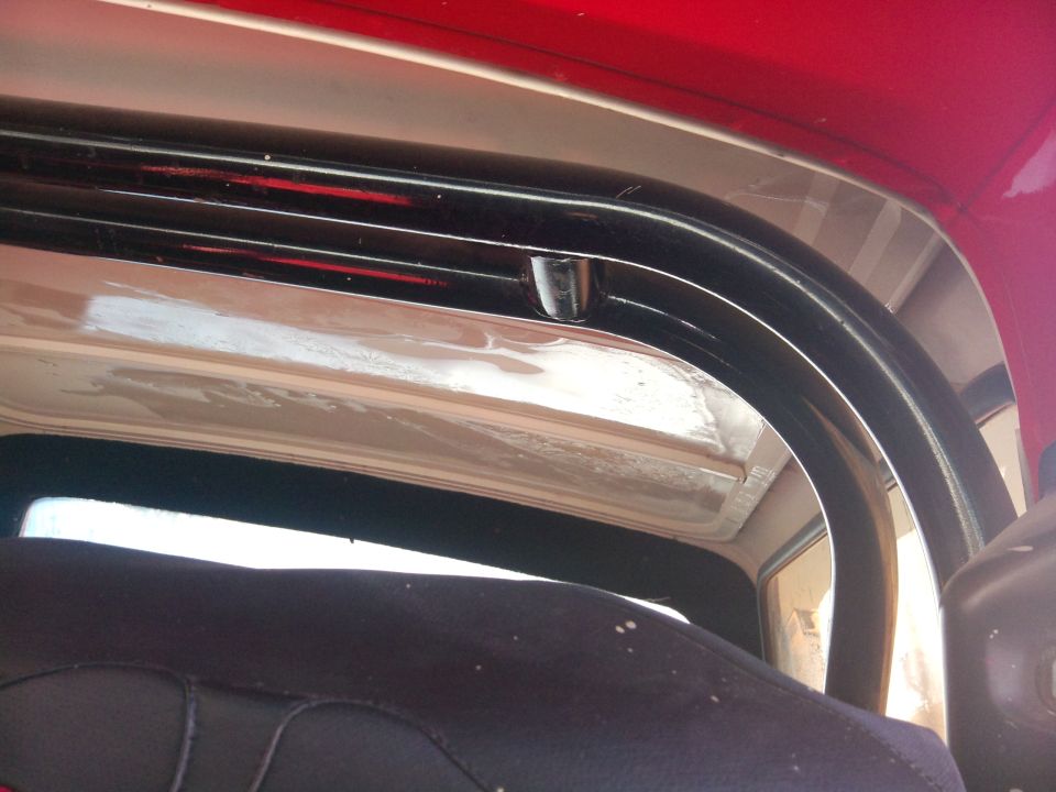 Interior roll bar and red exterior paint of a 1979 Ford Bronco