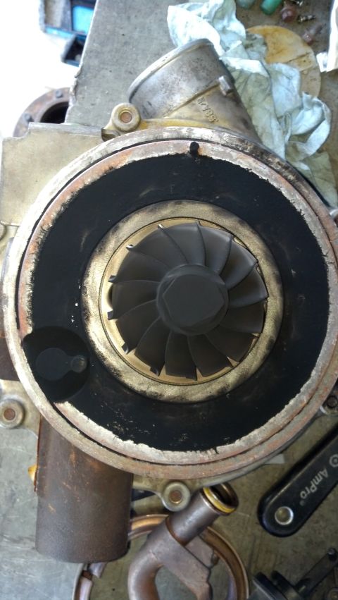 1995 Ford Bronco - Close-up of a turbocharger, showing internal components and wear.