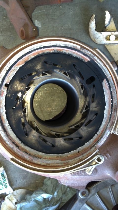 1995 Ford Bronco - Close-up view of a turbocharger impeller showing significant carbon deposits and wear on the blades.