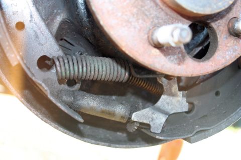 1976 Ford Ranchero - This image shows the internal components of a vehicle's drum brake system, including springs and brake shoes.