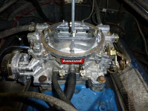 1961 Ford Ranchero - A close-up view of an Edelbrock carburetor, a key component in a vehicle's fuel system.