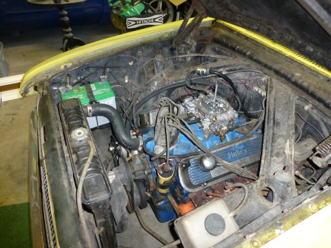 1961 Ford Ranchero - V8 engine bay with Holley valve covers and carburetor visible.