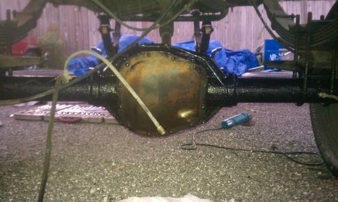 1995 Ford Bronco - Close-up view of a vehicle's rear axle differential, showing its components and suspension.