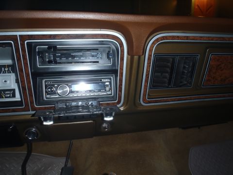 1979 Ford Bronco - Dashboard of a 1979 Ford Bronco woodgrain accents and an aftermarket JVC stereo system.